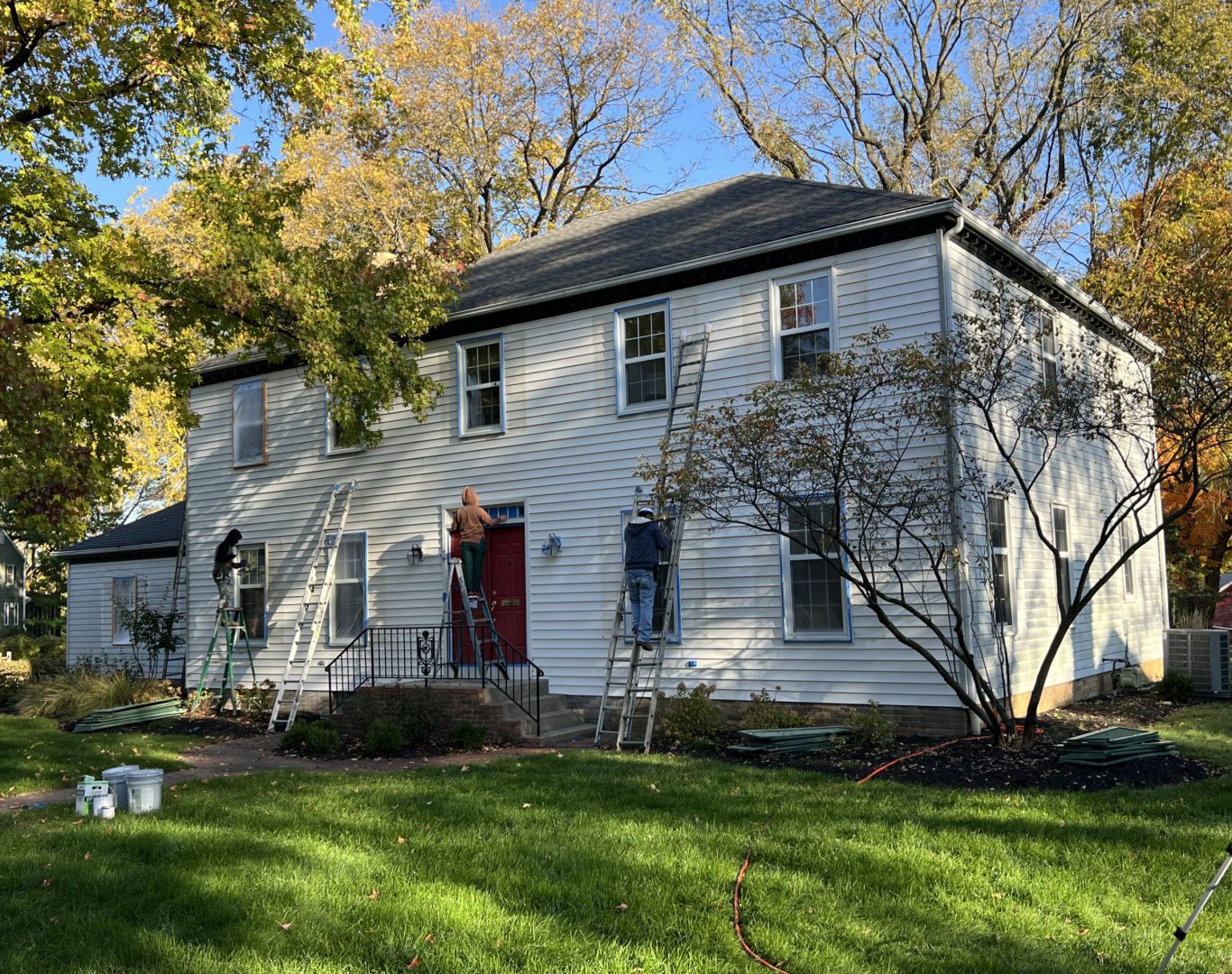 Green Diamond Painting team working on a home's exterior in New Albany