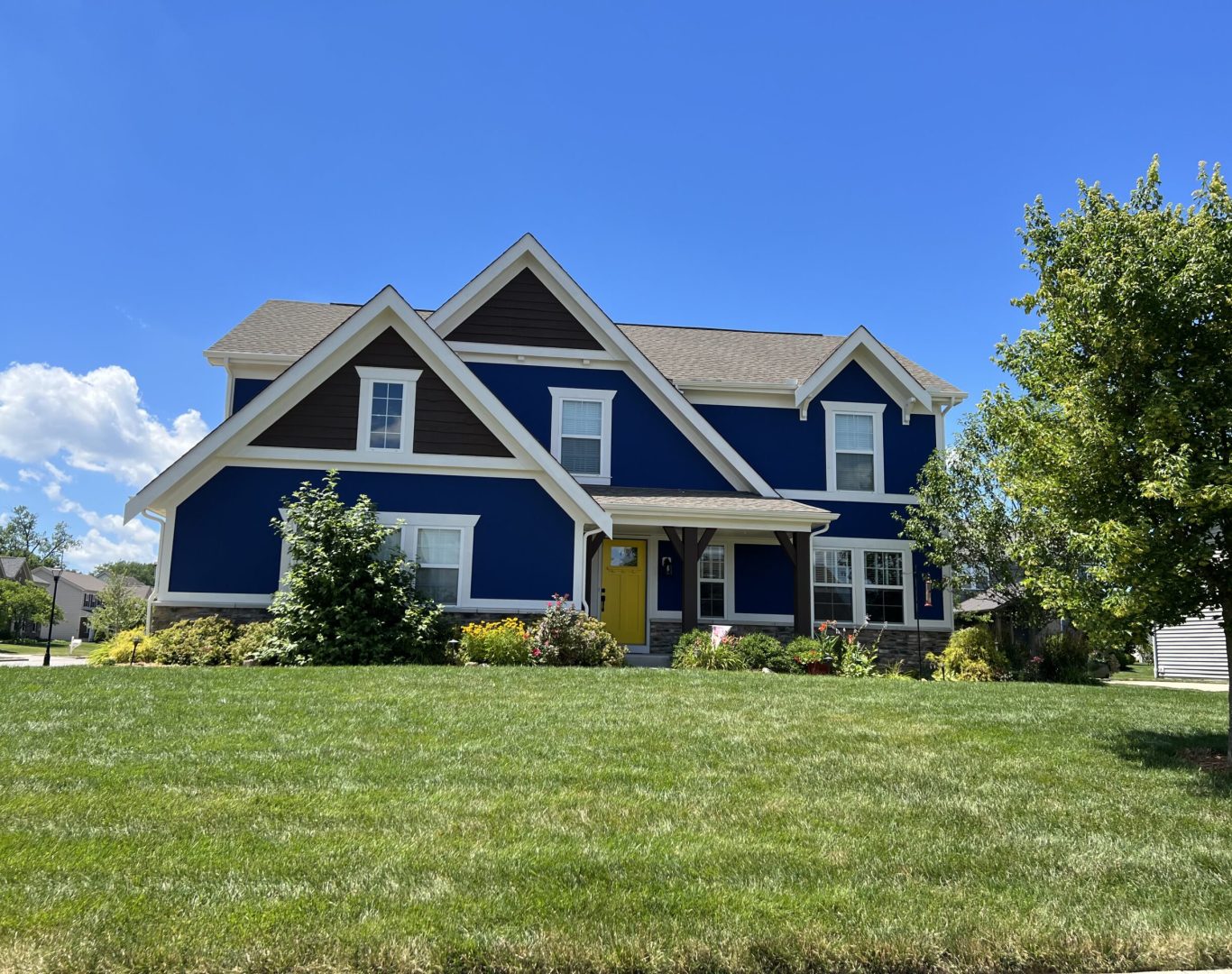 Professional exterior residential painting in Columbus, OH, showcasing a beautifully refreshed home.