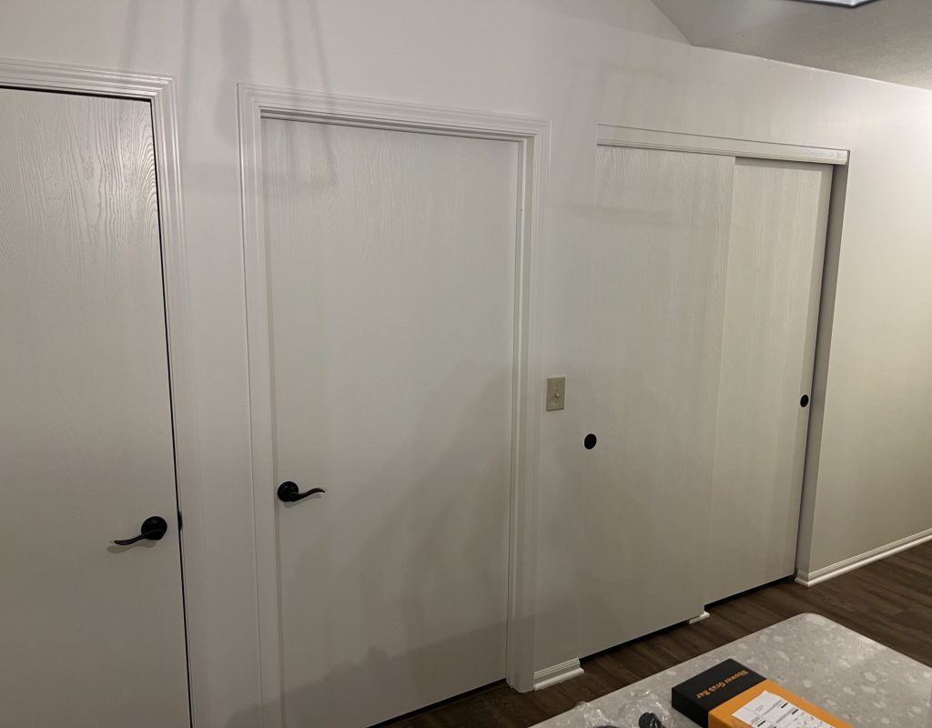 Professional painter applying a fresh coat to a home’s exterior in Upper Arlington, OH