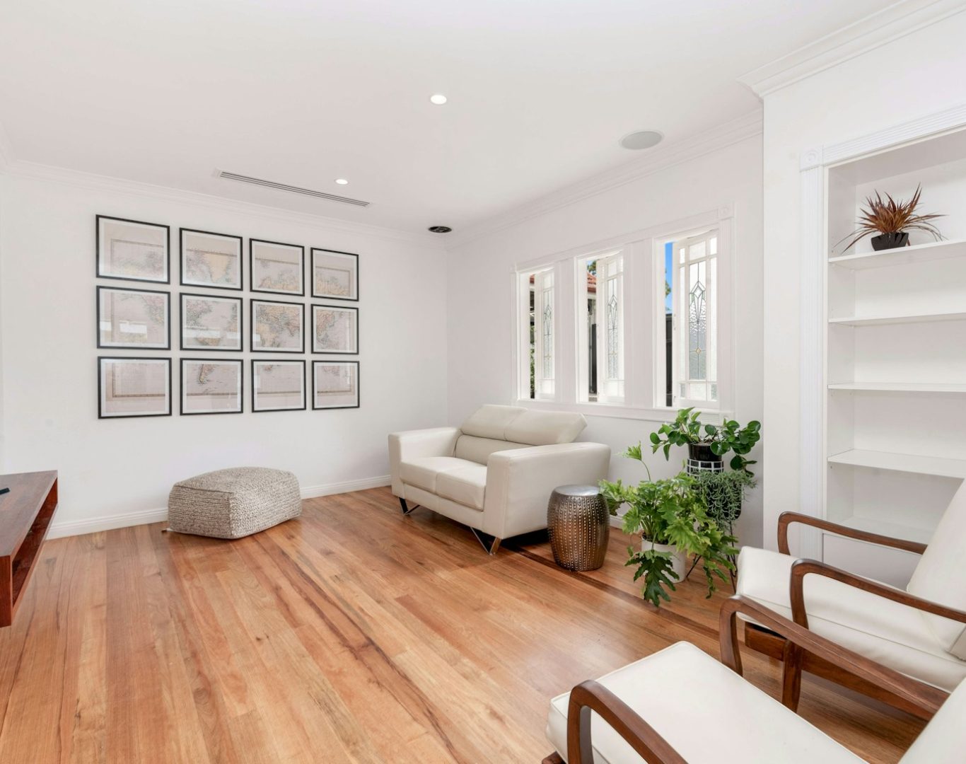 a living room filled with furniture and a flat screen tv